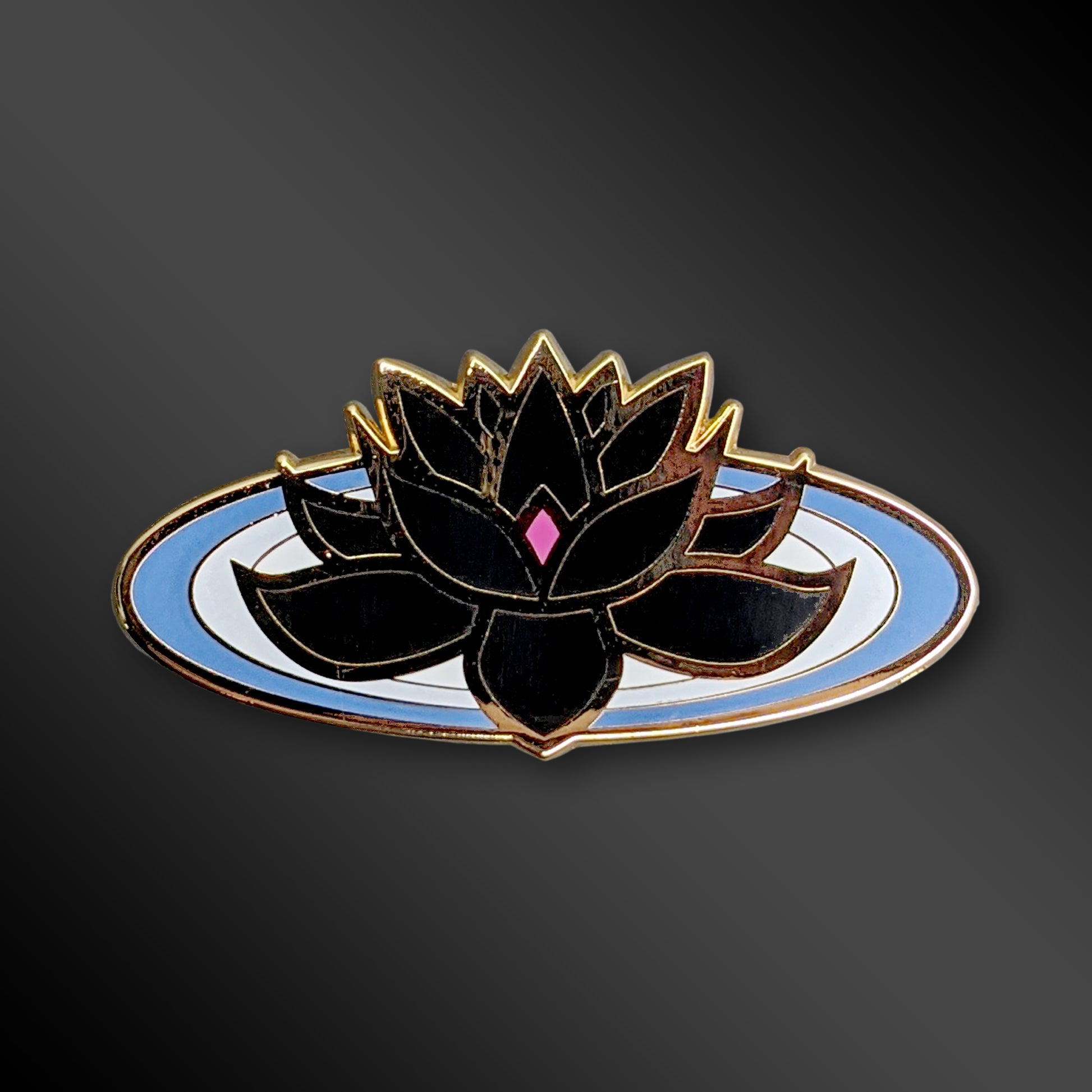 Black Lotus enamel pin with Buddhist symbol design
