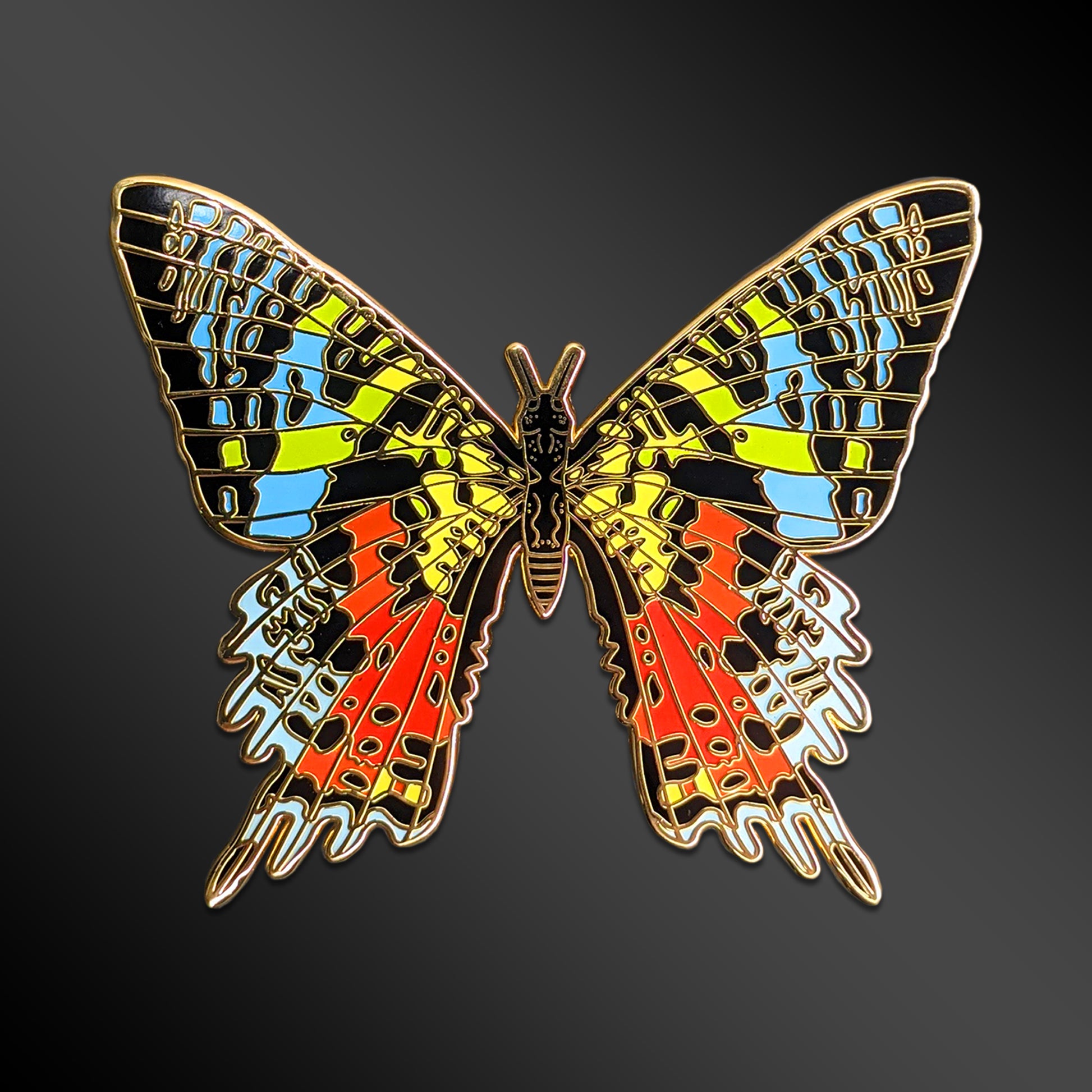 Madagascan Sunset Moth enamel pin with exotic insect design
